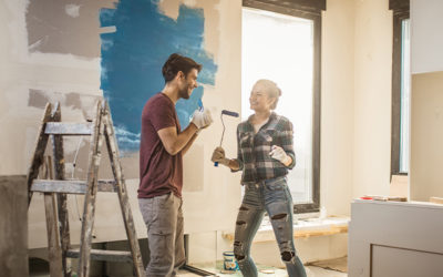 a couple painting and remodeling their house