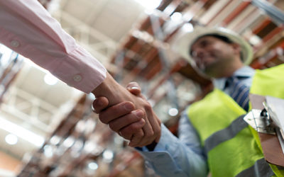 architect shaking hands with man